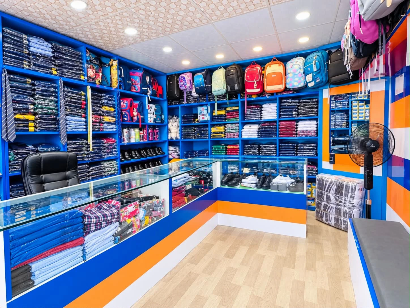 Uniforms, shoes and school bags displayed inside Pragati Venus Uniform